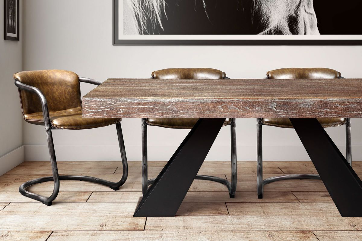 A dining set from TOV that mixes wood, leather, and metal materials.