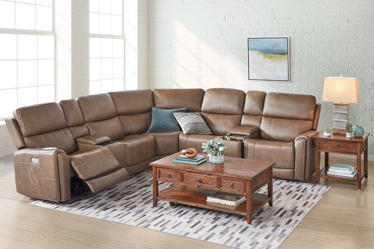 Brown leather sectional couch with powered reclining features.